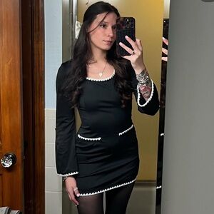 Elegant Black Dress with White Trim